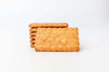 Kare şeklinde atıştırmalıklar. Tereyağlı ve hindistan cevizi aromalı tatlı. Çıtır çıtır