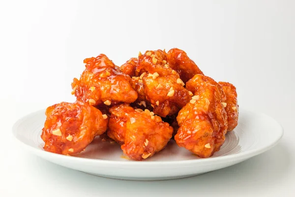 Korean food culture. Fried chicken with sweet and sour sauce. Fried chicken