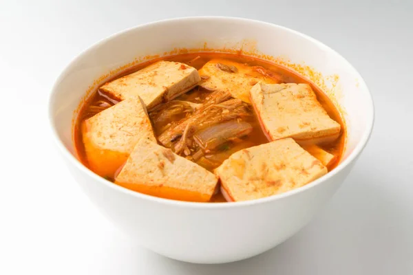 Boiled soup with tofu. A dish seasoned with tofu. Cooked with vegetables
