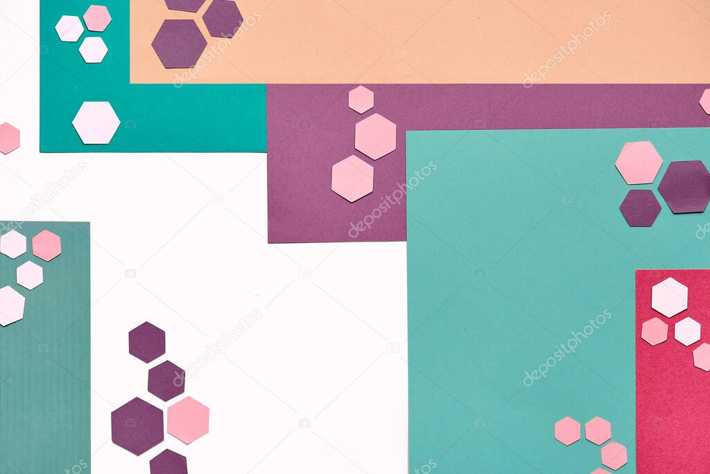 Abstract geometric layered paper background with trendy hexagons in neutral muted colors, mint green, red and brown. Flat lay, top view on white background.