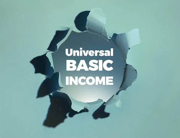 Text Universal Basic Income Objevuje Bílým Tučným Písmem Papírové Díry — Stock fotografie