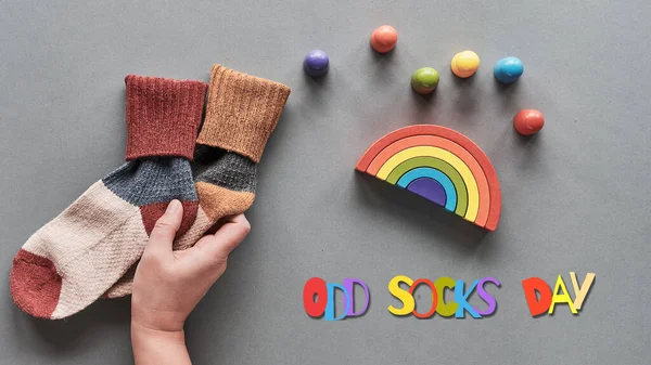 Odd Socks Day Hand Hold Pair Mismatched Socks Wooden Rainbow — Stock Photo, Image