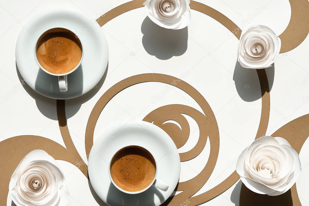 Espresso coffee cups, Fibonacci sequence circles. Espresso, tasty perfection. Golden ratio concept, paper flowers, white roses. Top view, flat lay, paper art in two tones - white and brown.