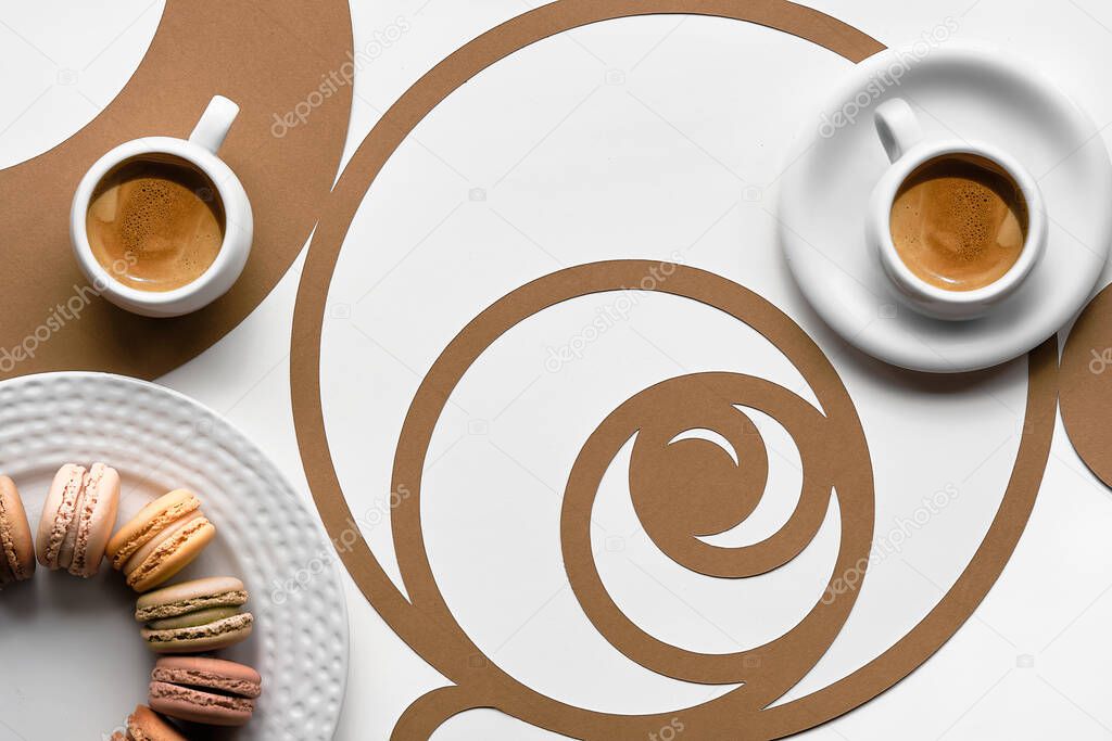 Coffee cups, macarons, Fibonacci sequence circles. Espresso, tasty perfection. Golden ratio concept, paper art. Top view, flat lay in two tones. White, brown colors.