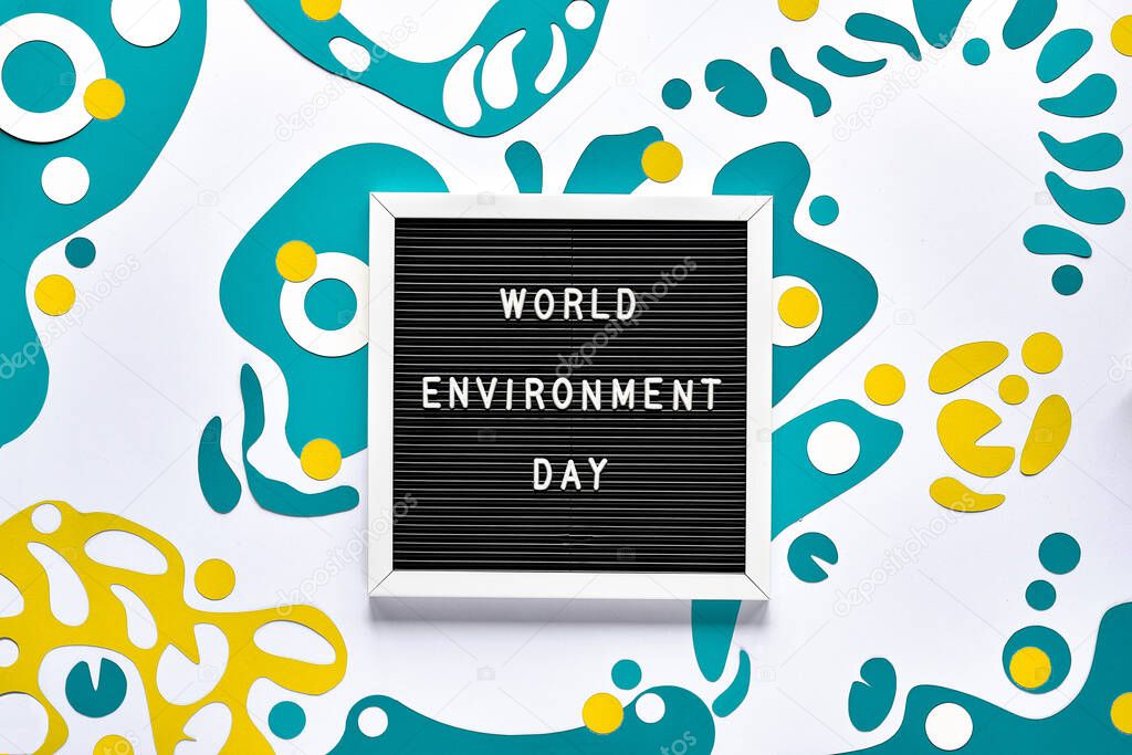 World Environment day. Abstract fluid shapes, paper art in green color, off white concept background, monochrome look. Message text board. Holiday to celebrate sustainable eco friendly lifestyle.