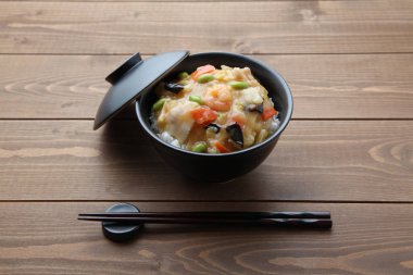 rice bowl Chinese style vegetable meat seafood with chopsticks isolated on table