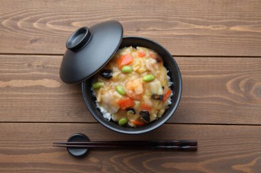 rice bowl Chinese style vegetable meat seafood with chopsticks isolated on table