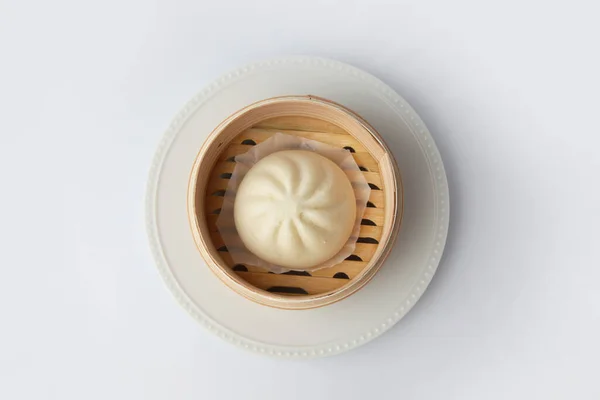 steamed meat bun baozi on white background