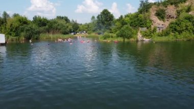 people bathe in the lagoon