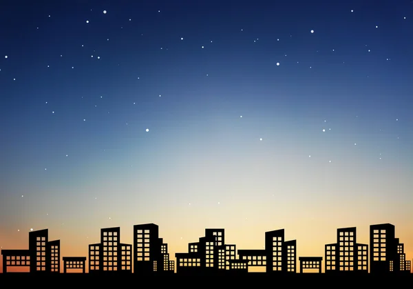 Stad van nacht met hemelachtergrond — Stockfoto