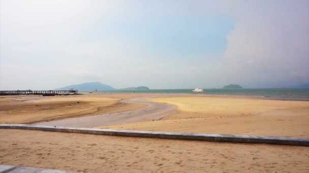 Low tide of the beach in the afternoon. Seashore with battleship far away — Stock Video