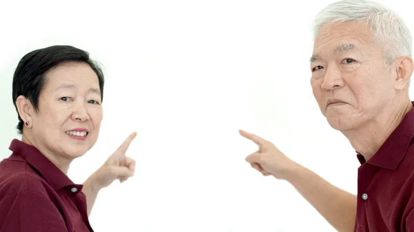 Asian senior couple pointing white isolate backgroun — Stock Photo, Image