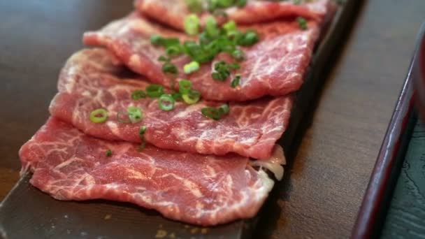 Beef sliced meat for Japanese shabu hot pot Asian style — Stock Video