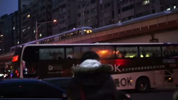 Taipei, Taiwan - February 2016: People, crowd and transportation in downtown business area after work at night — Stock Video