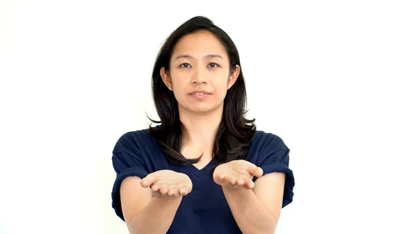 Asian girl doing presentation hand gesture with  copy space — Stock Photo, Image