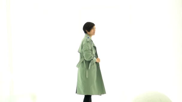 Tall Cool Asian Woman Active Jumping Winter Jacket — Stock Video