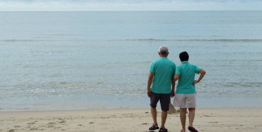 Asian senior couple travel to beach sea relax happy love relationship
