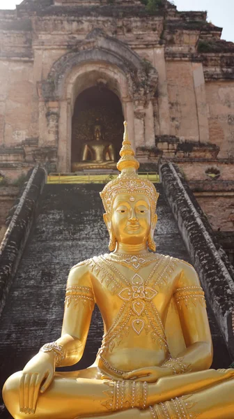 Golden buddha in front of ruins temple, Thailand — Stock Photo, Image