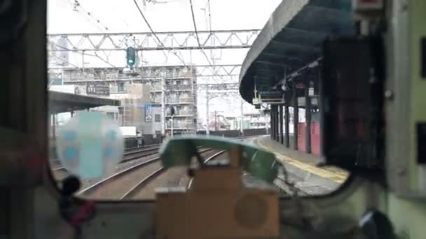 Window of local Japanese train with classic phone — Stock Video