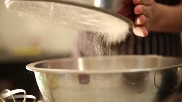 Video hand Sifting dusting flour with light setting — Stock Video