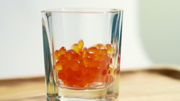 Red caviar, salmon roe, ikura in shot glass tasty raw seafood — Stock Video