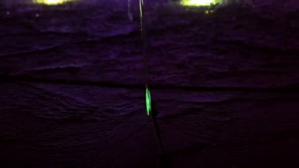 A close up shot of a fountain water feature clear water line and jets with changing colour LED light — Stock Video