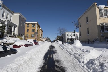 Snow covered streets and homes  clipart