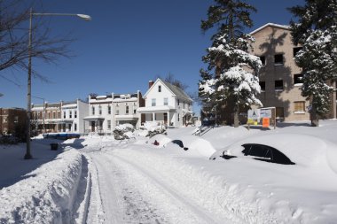 Snow covered streets and homes  clipart