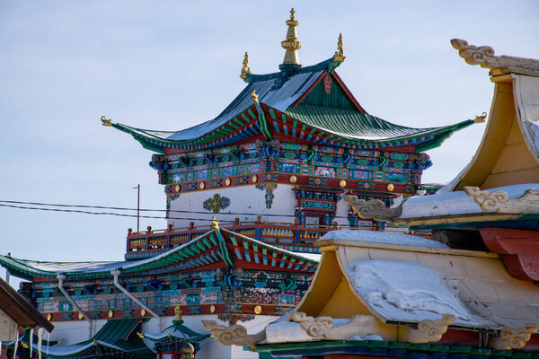 Buryatia, Russia - Feb 2020: The gate of Ivolginsky datsan monastery at sunny winter day. It is Buddhist Temple located near Ulan-Ude city.