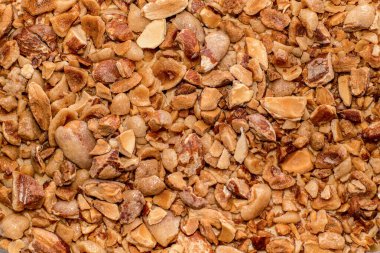 Ezilmiş şeker kaplı karamelize badem arkaplanı. Tatlılar