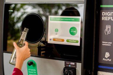 Sydney, Australia 2020-01-18. Return and Earn public return point for recycling. Reverse Vending Machine for refund and recycling of glass bottles. Recycling clipart
