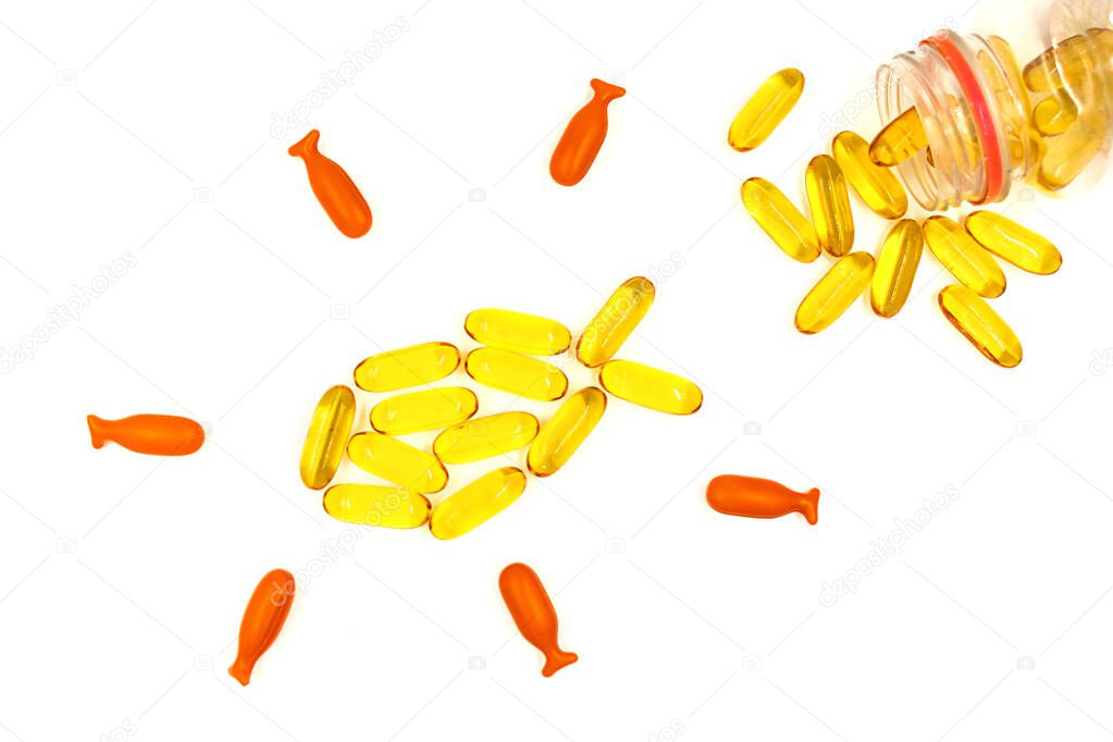 Omega-3 fish oil capsules on white background. Vitamins and supplements