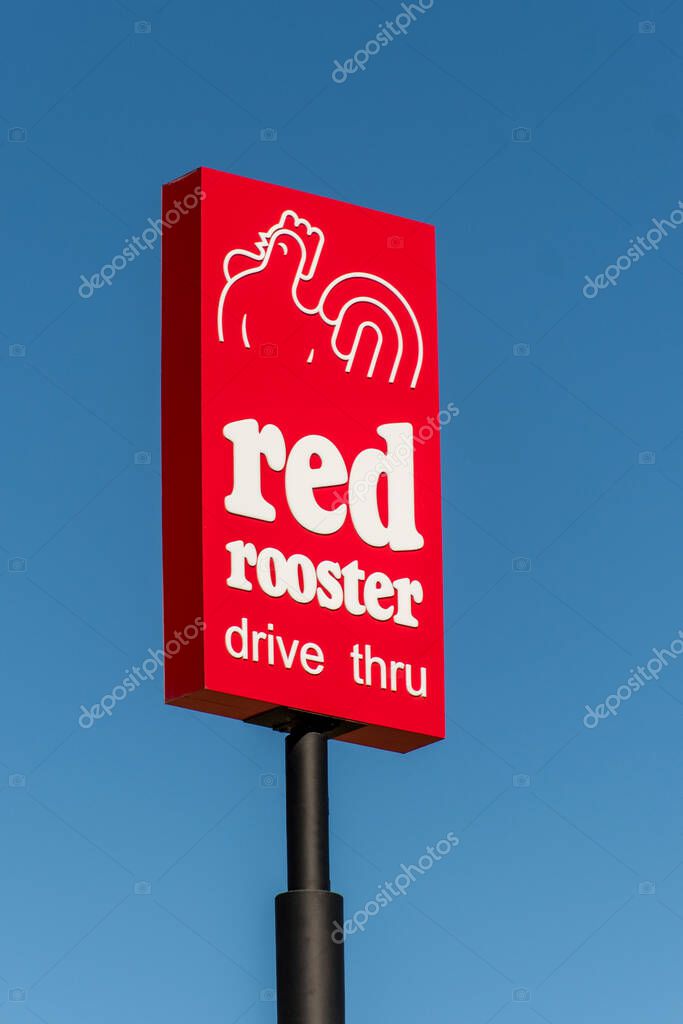Lithgow, Australia 2021-04-03 Red Rooster franchise fast food restaurant drive thru logo sign.