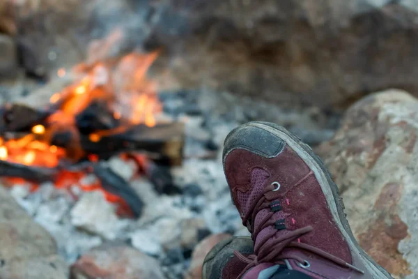 Campfire burning in the rocks. Camping life. Outdoor recreation. Selective focus