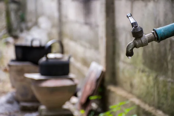 Old Faucet Water Leaking Drop Ground Blurred Background Cooking Pot — Stock Photo, Image