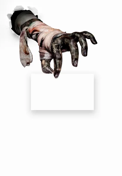Zombie hand holding a  white paper on white .Halloween concept — Stock Photo, Image