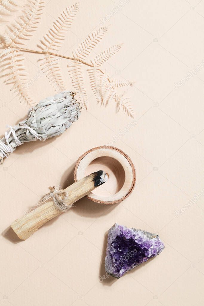 Palo Santo sticks, dried sage and druse amethyst, magic rock for ritual, witchcraft, spiritual practice, meditation. esoteric life balance concept.