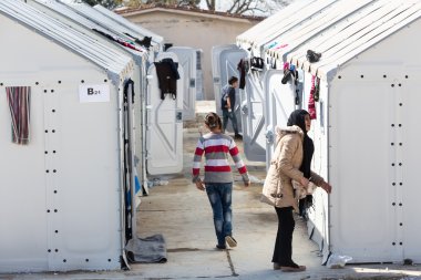 Refugees  living in tents in the center relocation Diavata clipart