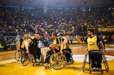 unidentified people play a friendly game of wheelchair basketbal clipart