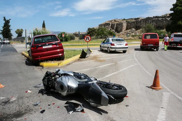 Traffic accident between a car and a motorcycle — Stock Photo, Image