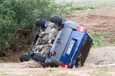  Car overturned with one dead from the flood in Liti near Thessa clipart