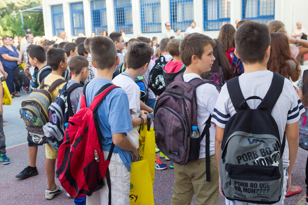 Students with their backpacks. First Day of school for the stude
