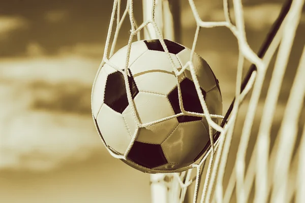 Soccer football in Goal net with sky field. BW Toned. — Stock Photo, Image