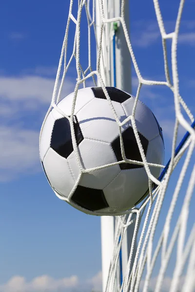 Soccer football in Goal net with sky field. — Stock Photo, Image