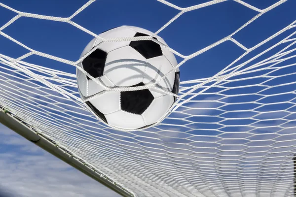 Soccer football in Goal net with sky field. — Stock Photo, Image