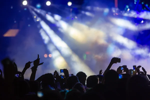 People taking photographs with touch smart phone during a music — Stock Photo, Image