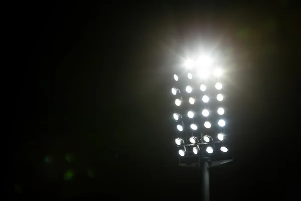 Stadium Lights against Dark Night Sky with Copy Space