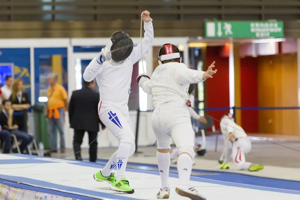 Young athletes competing during the World Youth Fencing Champion — Stock Photo, Image