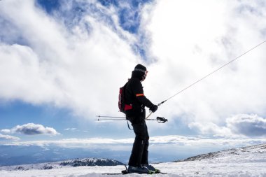 Skiers enjoy the snow at Kaimaktsalan ski center, in Greece. Rec clipart