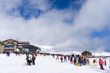 Skiers enjoy the snow at Kaimaktsalan ski center, in Greece. Rec clipart